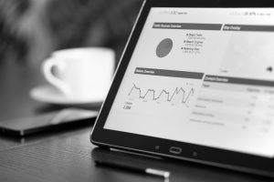 ipad with mug and report