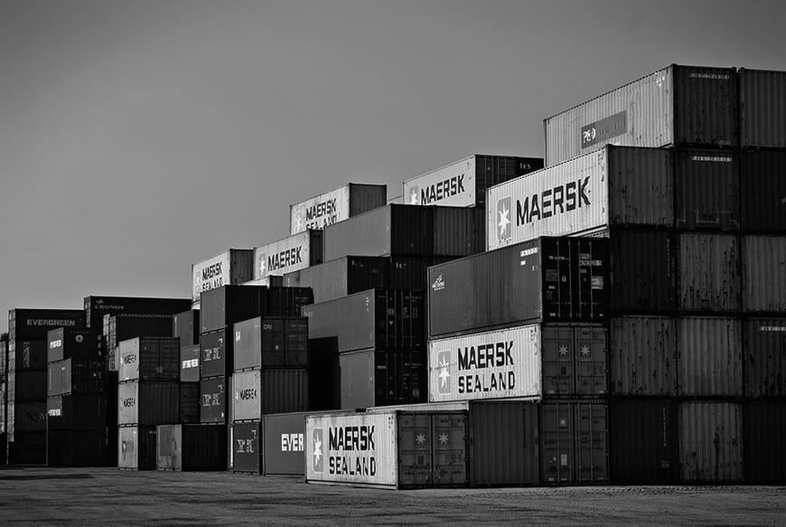 Stack of shipping containers, black and white