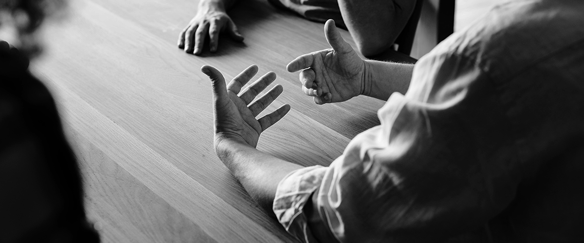 best analytics team people talking around a table