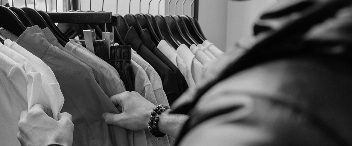 customer lifetime value man touching clothes on a rack