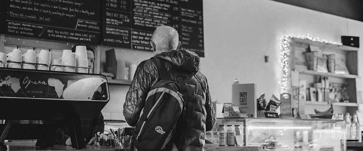 loyalty schemes man ordering coffee